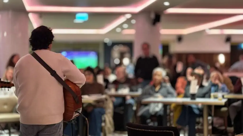 a guitarist plays to a crowd at resistance jam