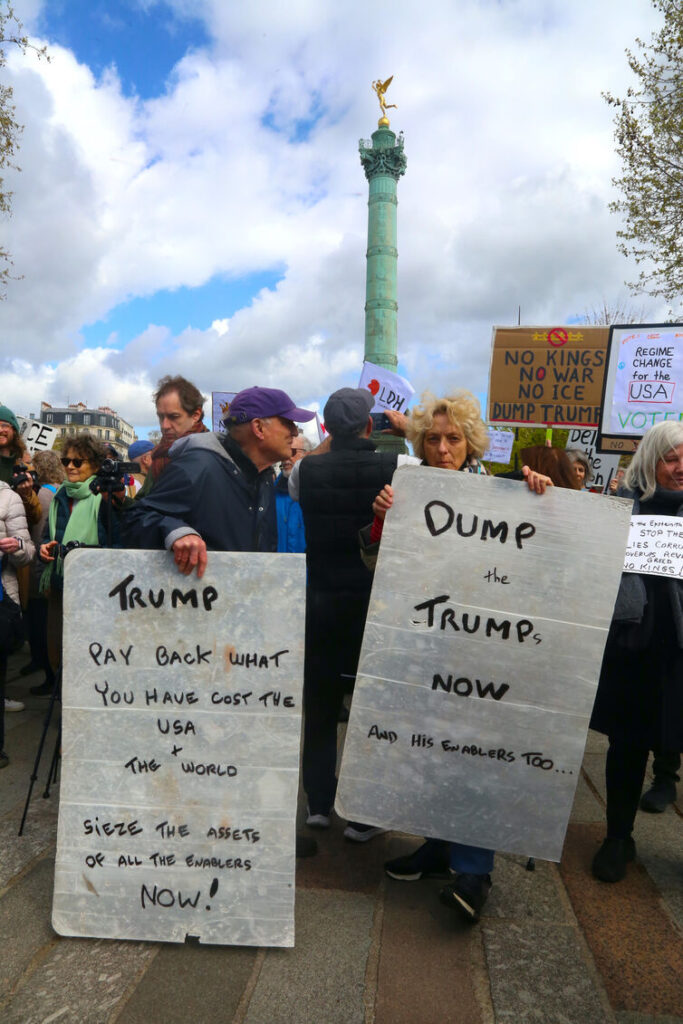 photo shows protests with anti trump signs in front of bastille column at No Kings 3 on March 28th 2026 in Paris France